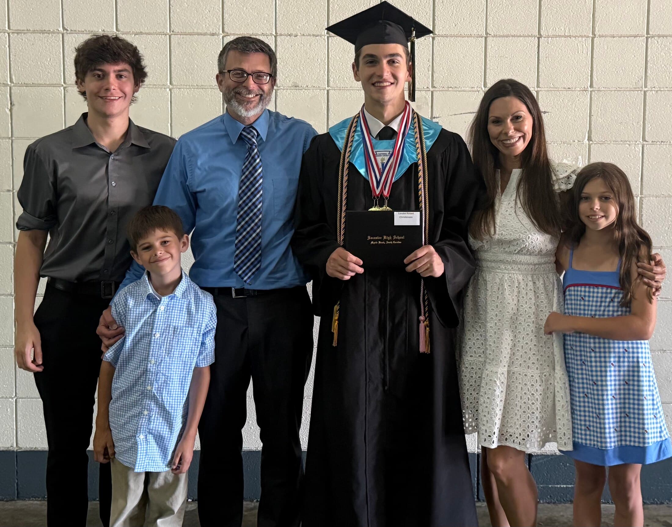 Joe Clarke with his family at a graduation